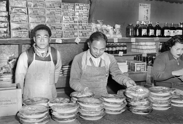 Workers standing behind Counter at Co-op Store