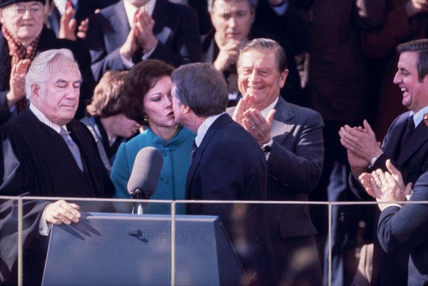 U.S. President Jimmy Carter kissing wife