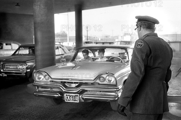 U.S. Immigration Officer watching as Car enters El Paso