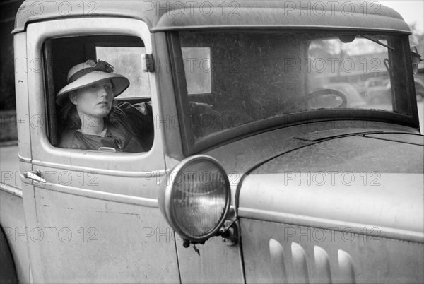 Woman sitting in Truck on Saturday Afternoon