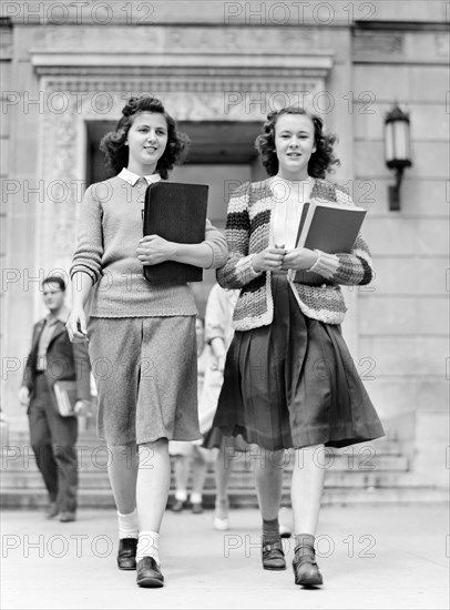 Two Students coming out of Library at Iowa State College