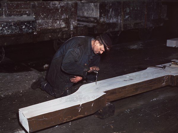 Workman repairing broken Locomotive Frame