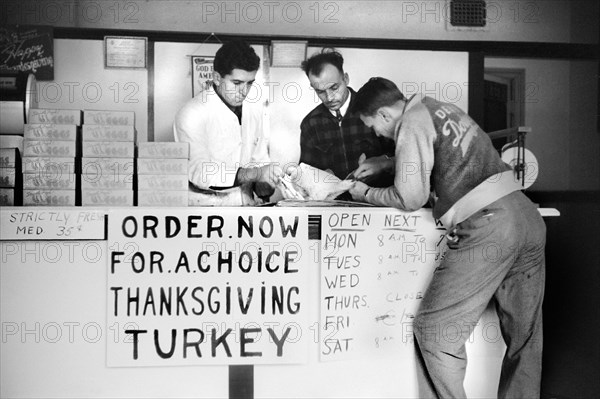 Workers reviewing Paperwork in Meat Store