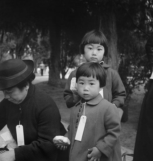 Members of Mochida family awaiting Evacuation Bus