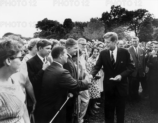U.S. President John F. Kennedy greeting Peace Corps Volunteers on South Lawn of White House