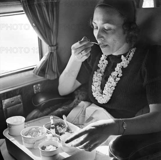 Woman eating Meal during American Airlines flight from Washington to Los Angeles