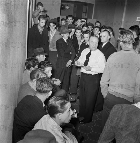 Group of Young Men waiting to Enlist at U.S. Navy Recruitment Headquarters