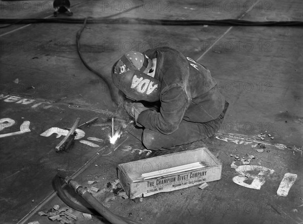 Female Welder at Shipyard