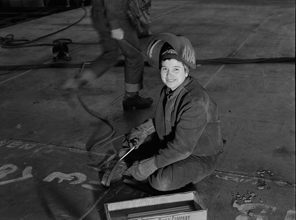 Female Welder at Shipyard