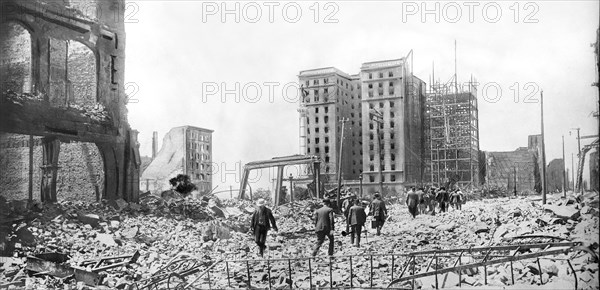 People walking through Rubble 2 days after Earthquake