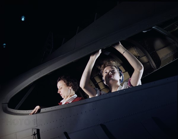 Two Women working on Bomber