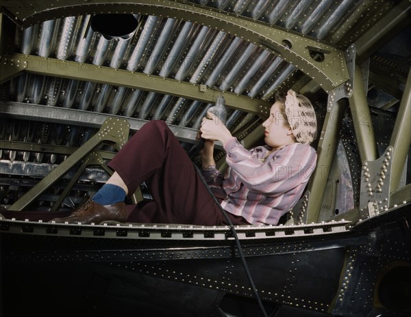 Woman riveting A-20 Bomber