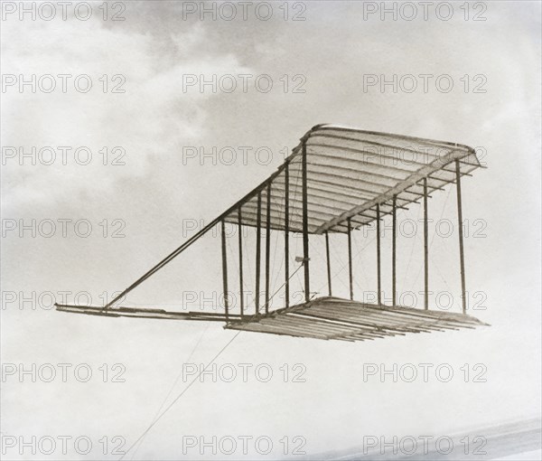 Left side view of glider flying as kite