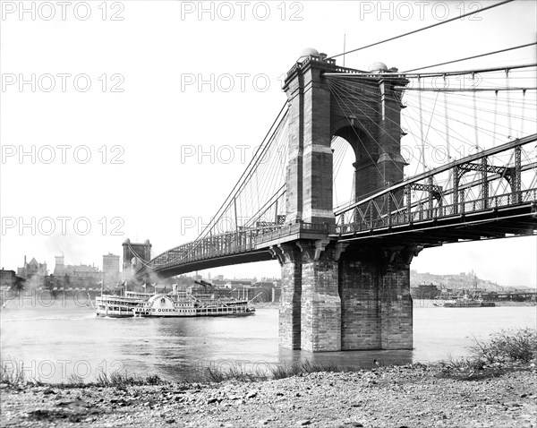 Riverboat and Suspension Bridge