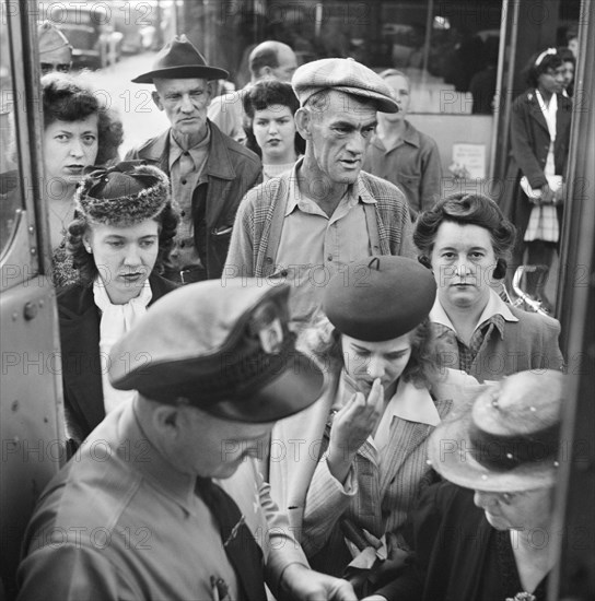 People boarding Greyhound bus at small town between Chicago