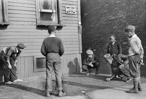 Boys playing Marbles