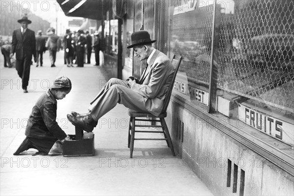 Young Boy shining Shoes