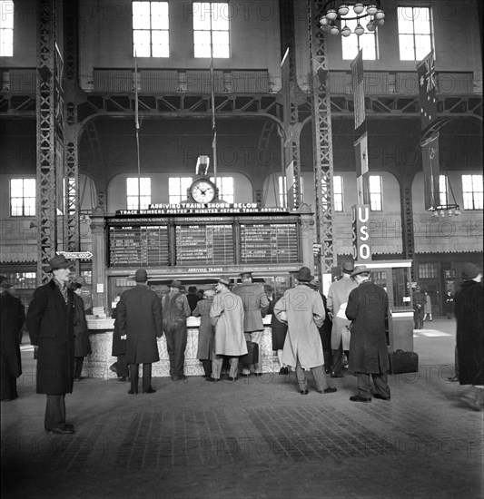 Group of People at Information Booth