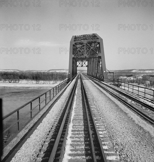 Railroad tracks crossing the Illinois River along the Atchison