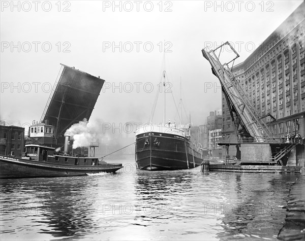 Freighter Arthur Orr and Tugboat Rita McDonald passing State Street bridge