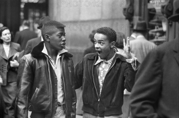 Two Teen Boys walking along Street