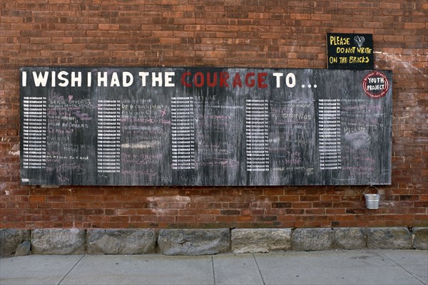 Public Chalkboard on Brick Wall