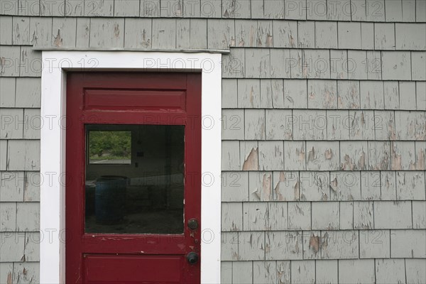 Red Door and Weathered Gray Wall