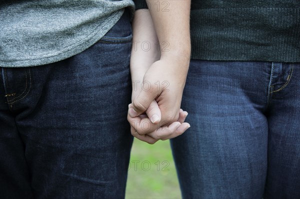 Two Women holding Hands