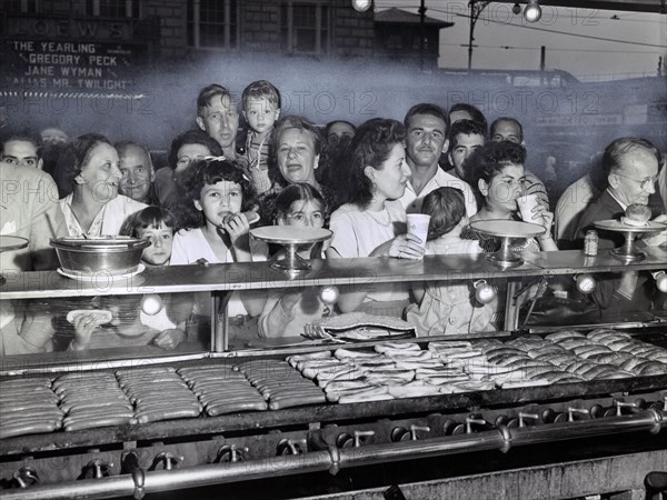 Group of People lined up at Counter