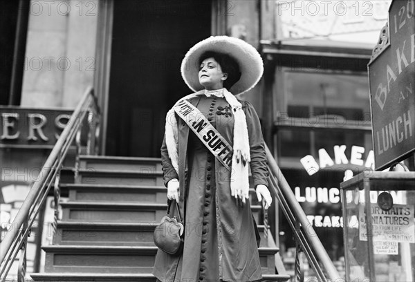 Actress and Suffragette Trixie Friganza descending steps