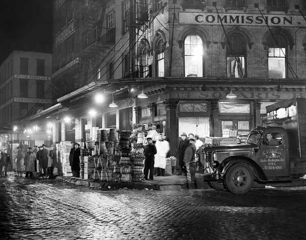 Trucks being loaded with Produce at Night