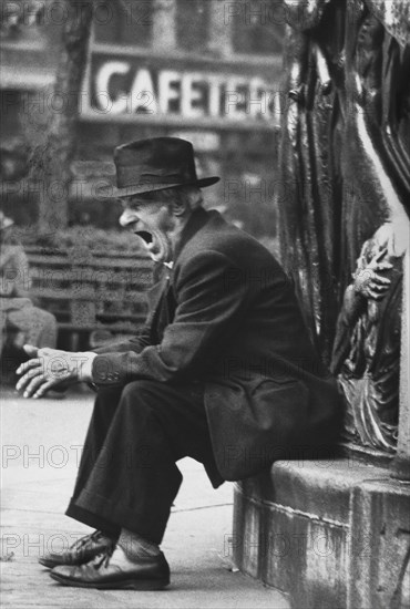 Yawning Man sitting in Union Square Park