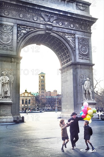 Man and Two Boys with bunch of Balloons