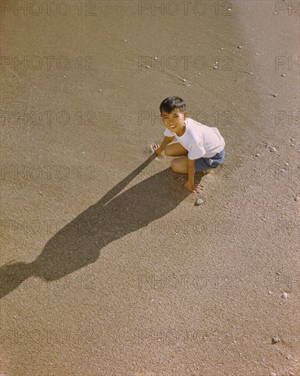 High Angle View of Young Japanese Boy on Beach