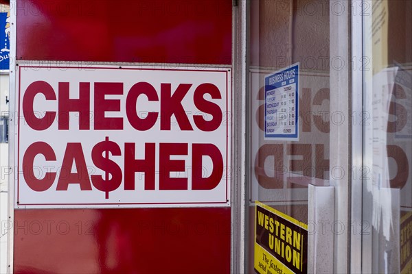 Checks Cashed Sign on Wall of Financial Services Business