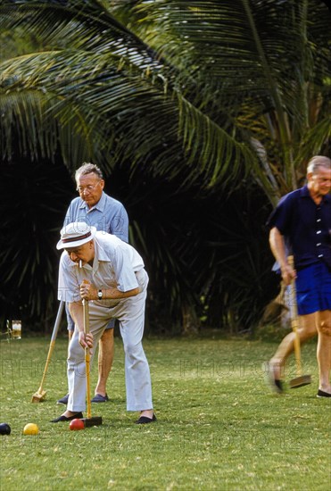 Men playing Croquet