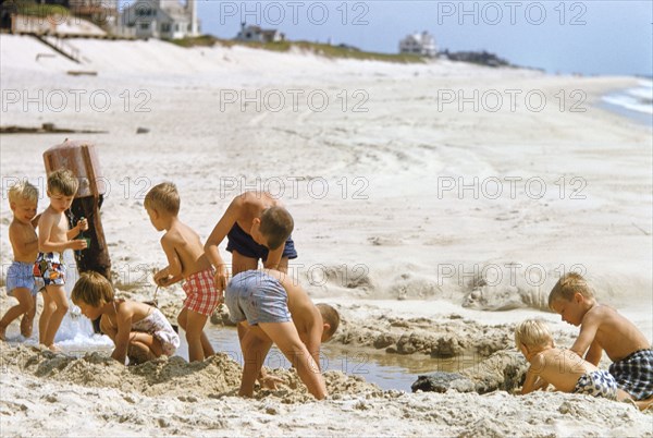 Group of Children playing on Sandy Beach