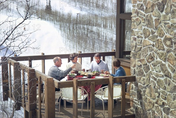 Former U.S. Secretary of Defense Robert McNamara with his wife Margaret and unidentified couple having lunch on Balcony