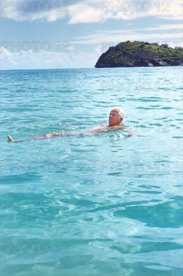 Man floating on Back in Water