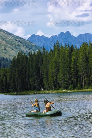 Two Girls rowing Rubber Boat