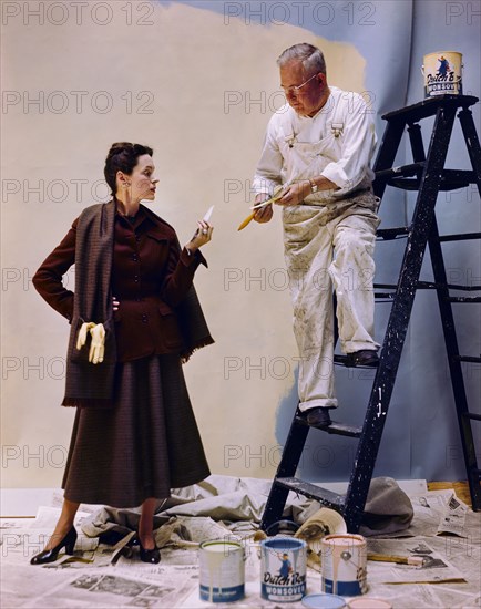 Woman discussing Color Samples with Painter