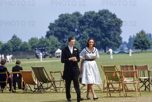 Teen Boy and Teen Girl attending Cricket Match