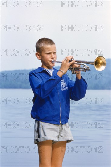 Boy playing Trumpet at Summer Camp