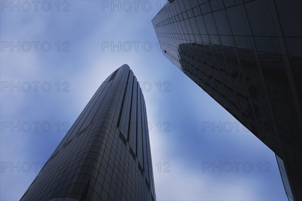 Low Angle View of Two Modern Glass Buildings