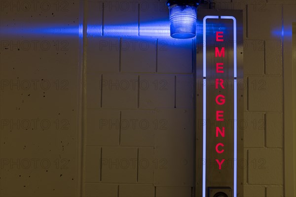 Illuminated Emergency Sign in Parking Garage