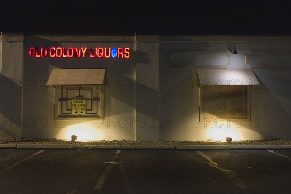 Liquor Store Parking Lot and Building Exterior at Night