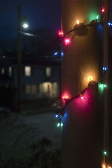 Christmas Lights wrapped around Porch Column at Night