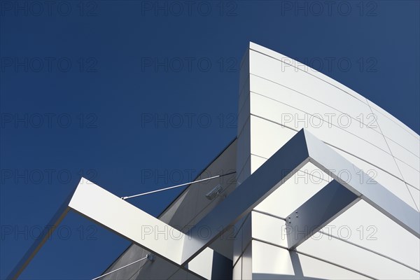 Low Angle View of Building Exterior Detail against Blue Sky