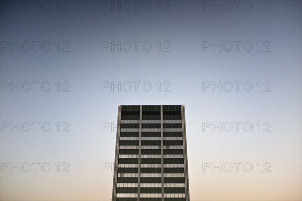 Modern Office Building Exterior against Sky at Dusk