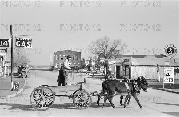 Farmer crossing Main Street of Town